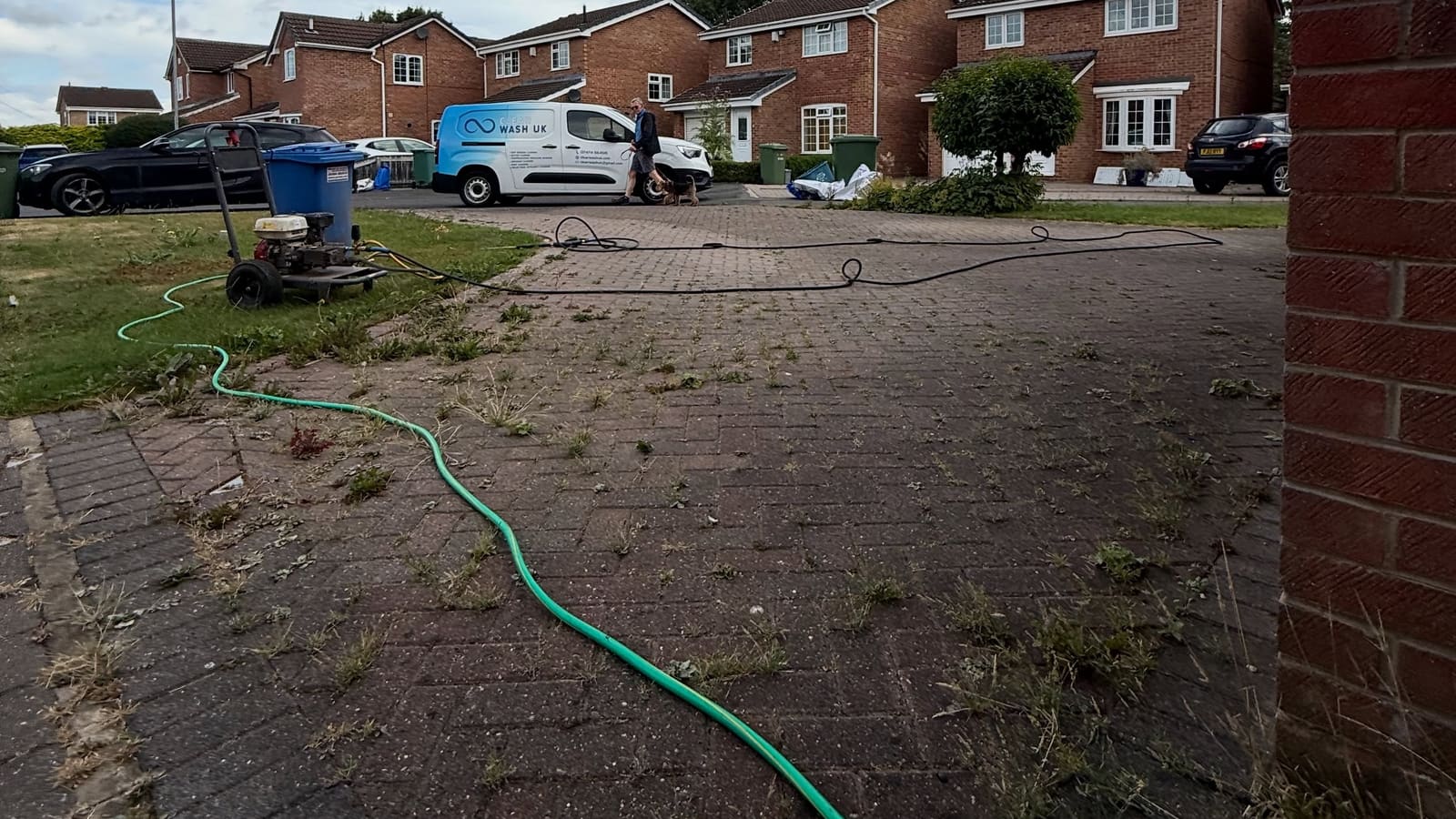 A block-paved driveway in Stockton-on-Tees, half still green with moss and half freshly pressure-washed