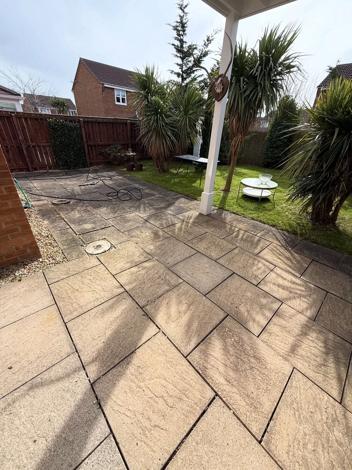 Sandstone patio before and after cleaning