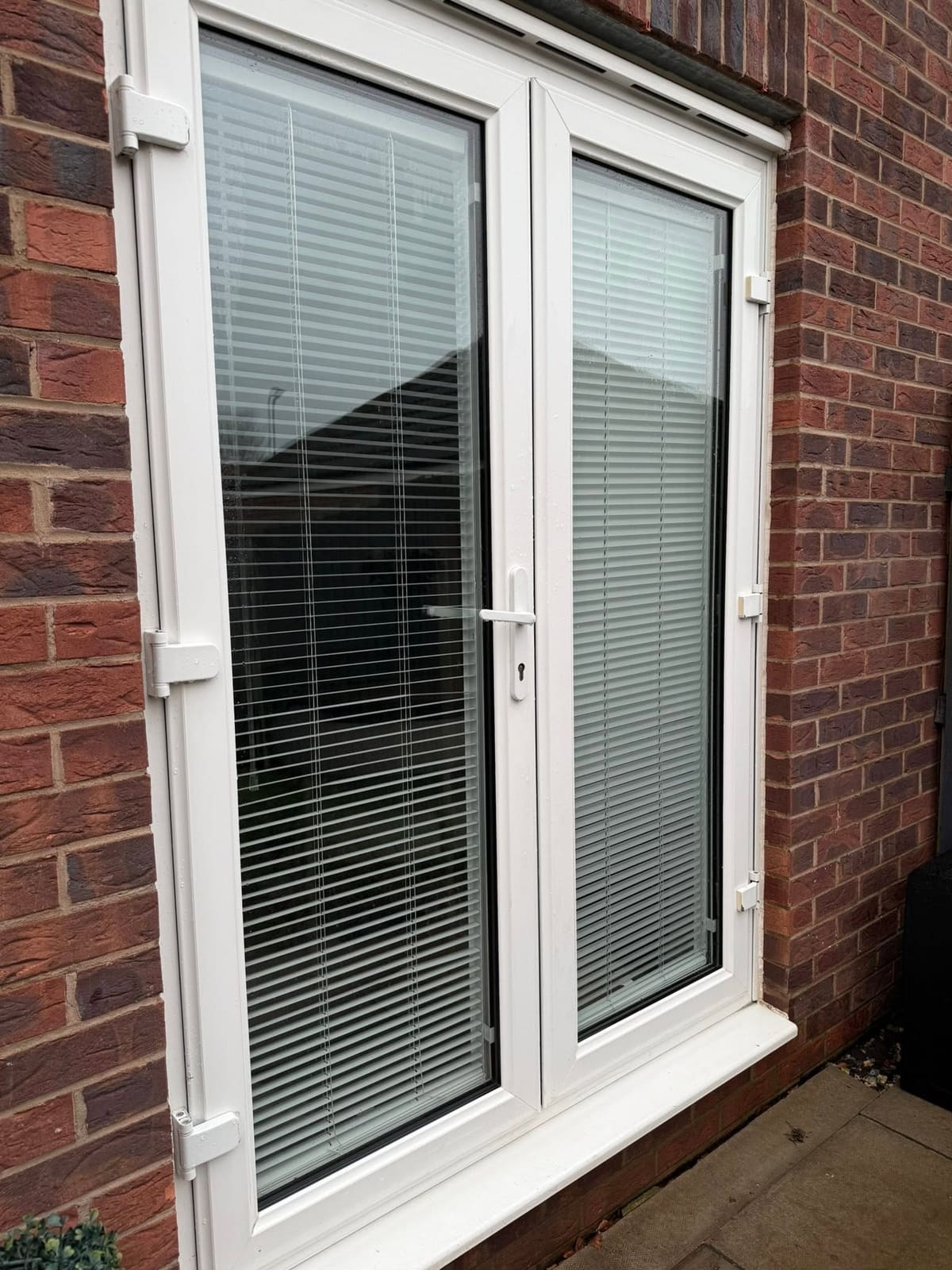 White uPVC French doors before and after cleaning